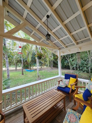 Terrace/patio - Charming 2-bedroom cottage in tranquil Spanish Lookout with AC, WiFi (Spanish Lookout)