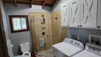 Shower, towels, soap, toilet paper