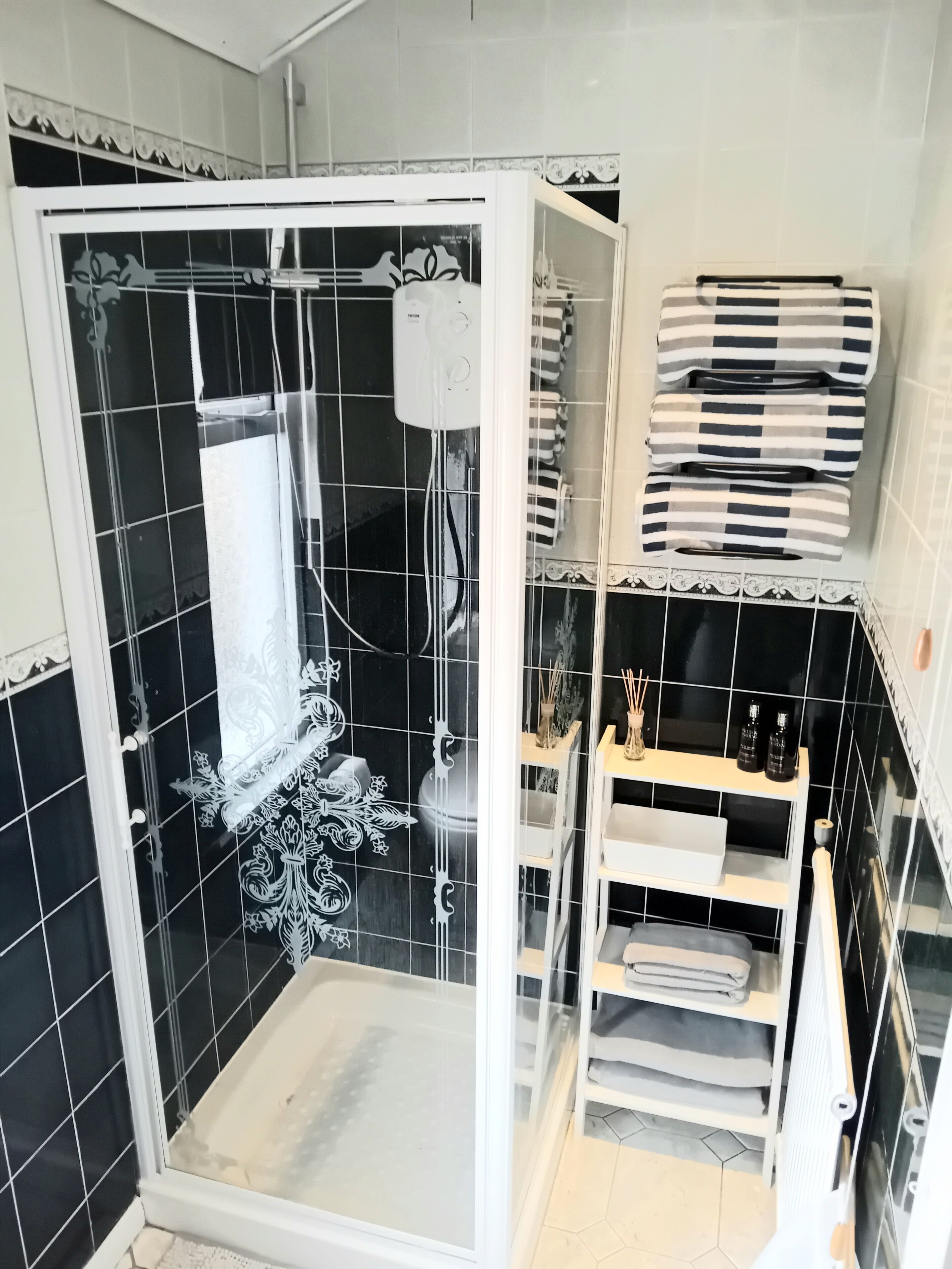 Shower, hair dryer, towels, soap