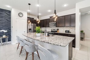 Fridge, microwave, oven, stovetop - 5BR Poolside Retreat (Kissimmee)