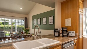 A modern kitchen with a large sink, coffee maker, and a sign that says "Coffee Time". - Huge Backyard, Near Disney, Family Friendly, Quiet Neighborhood (Placentia)