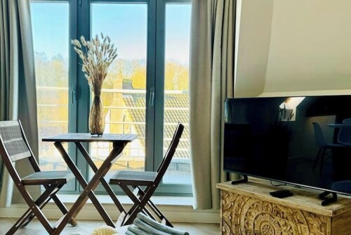 Stylish loft apartment in the center, facing the park.