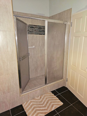 Shower, hair dryer, towels, toilet paper