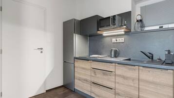 Fridge, microwave, cookware/dishes/utensils