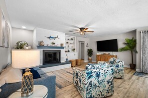 Smart TV, fireplace, books, stereo