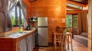 Fridge, microwave, coffee/tea maker, cookware/dishes/utensils