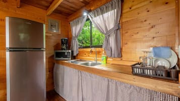 Fridge, microwave, coffee/tea maker, cookware/dishes/utensils