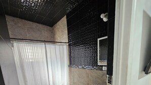 A bathroom with a toilet, sink, and shower curtain. - Full house in subdivision (Juárez)