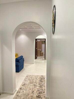 Suíte família | Área de estar | TV de tela plana