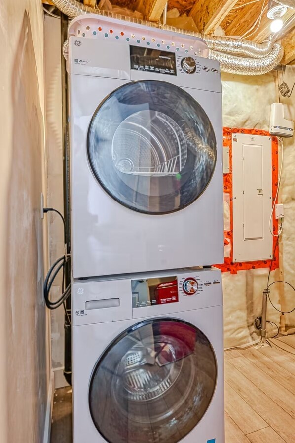 Convenient laundry facilities with two front-loading washing machines.