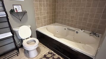 Jetted bath, hair dryer, towels, soap