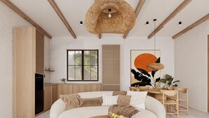 Een moderne woonkamer met een gebogen bank, een ronde salontafel en een eethoek met een houten tafel en stoelen.