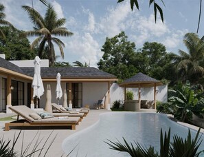 A poolside area with lounge chairs and umbrellas, a covered seating area, and a pool. - Sorrento Villa  by Betterplace (Petulu)