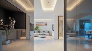 A modern living room with a sofa, coffee table, and decorative items.
