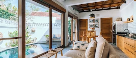 Superior Villa, Patio, Pool View | Living area