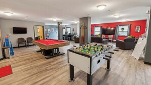A recreational area with a pool table, foosball table, and seating area. - Modern Retreat Near Campus & Local Trails (Mansfield)