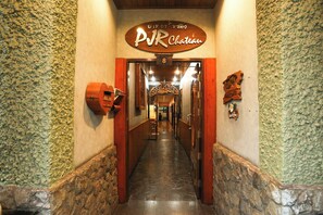 A hallway with a sign reading "PVR Chateau" and a number "8" above it. - Pjr Chateau (Bangkok)