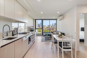 Fridge, microwave, oven, stovetop - City Views & Inner-North Cool at Your Door (North Melbourne)