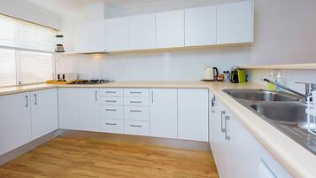 Comfort House, Multiple Beds, Non Smoking | Private kitchen | Full-size fridge, microwave, oven, stovetop