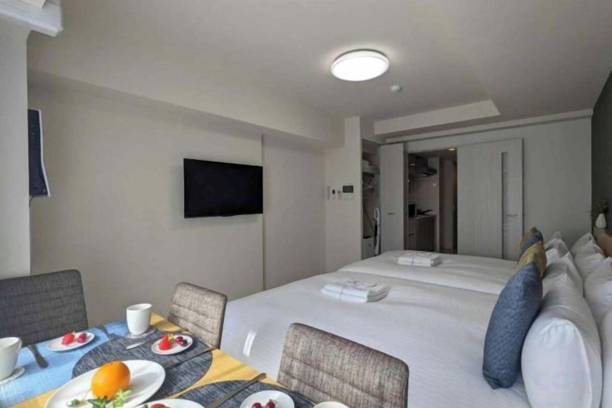 Premium bedding, laptop workspace, blackout drapes, soundproofing