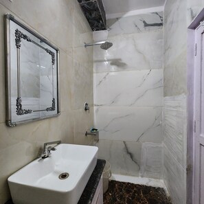 Shower, towels, soap, toilet paper