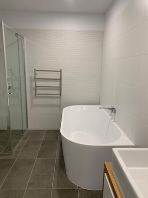 Shower, hair dryer, towels, soap