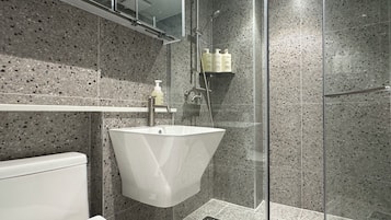 Shower, hair dryer, slippers, towels