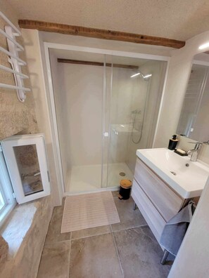 Shower, hair dryer, towels, soap