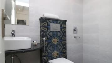 Shower, towels, soap, toilet paper
