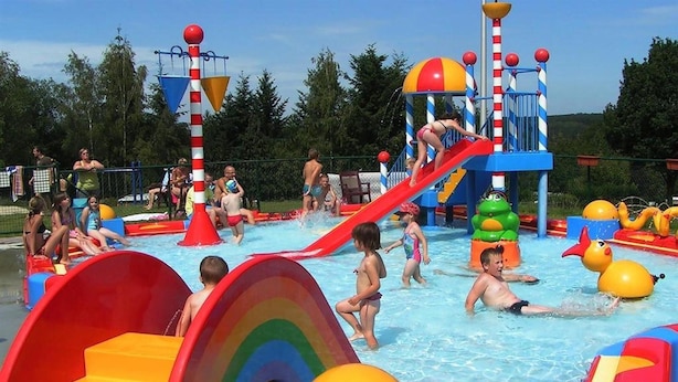 A water park with slides, inflatable structures, and a pool area. - Chalet in Olloy-sur-viroin With Patio (Viroinval)