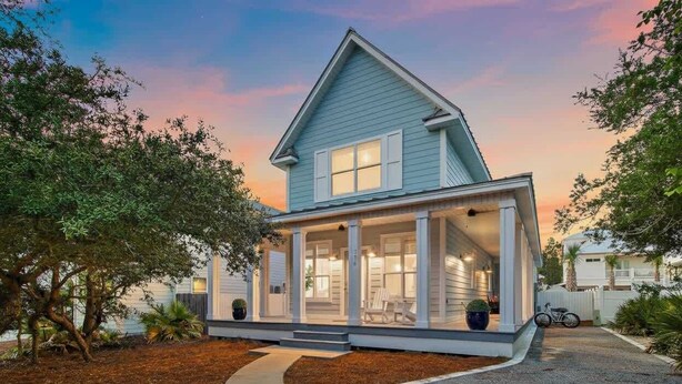 A two-story house with a covered porch and a driveway leading to the entrance. - Seagrove Gem | 4 Bikes | Golf Cart | Yard Games (Santa Rosa Beach)