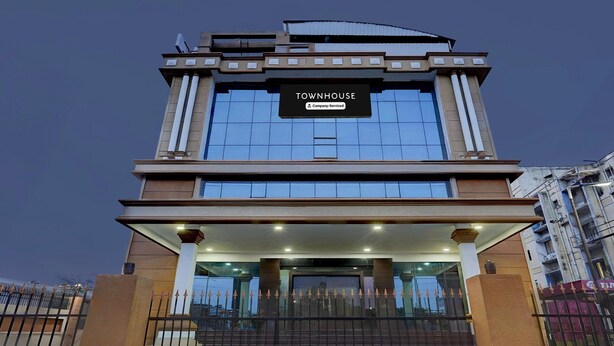 A modern building with a sign reading "TOWNHOUSE Company Serviced". - Super Townhouse Koyambedu Royal Plaza (Chennai)