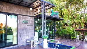 A modern building with a sign reading "Judy N Park & Resort".