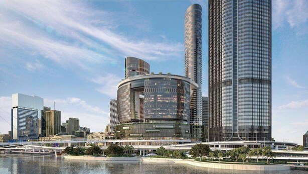 A modern high-rise building with a curved facade and a cylindrical tower, surrounded by other skyscrapers and a body of water. - Queens Wharf Gem Stylish 1BR in BNEsNew Landmark (Brisbane City)