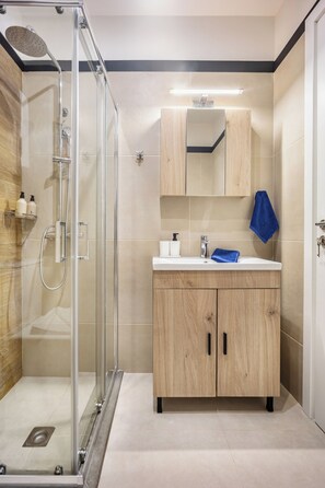 Shower, hair dryer, towels, soap