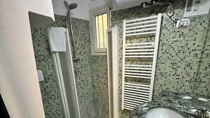 A bathroom with a shower, toilet, and sink. - Your nest in Trastevere, the heart of Rome - Your Nest in the Heart of Rome (Roma)
