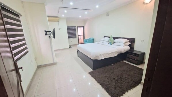 Suite Deluxe, balcón | 1 dormitorio y wifi gratis