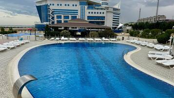 Seasonal outdoor pool, pool umbrellas, sun loungers