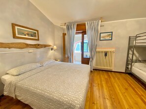 Quadruple Room, Balcony | Desk