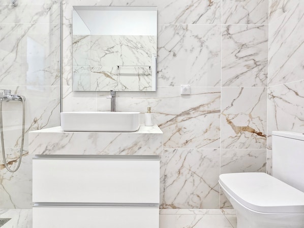 Shower, hair dryer, towels, soap