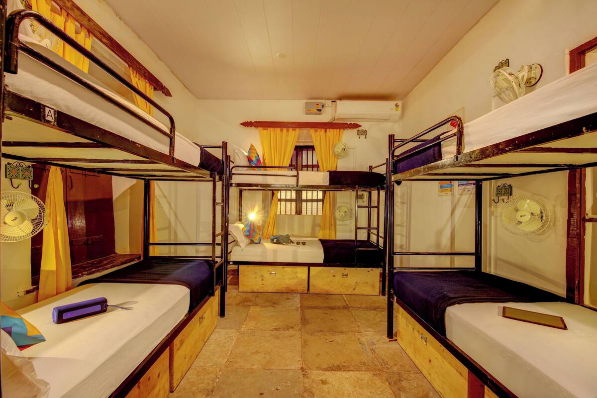 Bed in 12 Bed Mixed AC Dormitory Room with Shared Bathroom | WiFi (free)