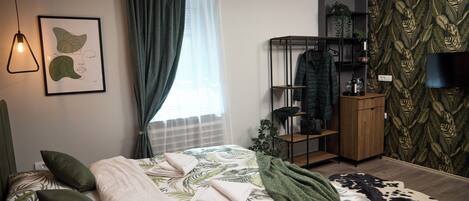 Laptop workspace, blackout drapes, soundproofing, iron/ironing board