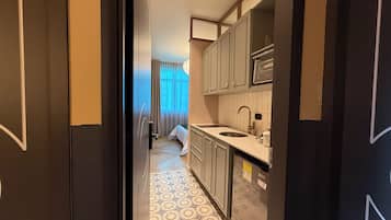 Microwave, stovetop, coffee/tea maker, cookware/dishes/utensils