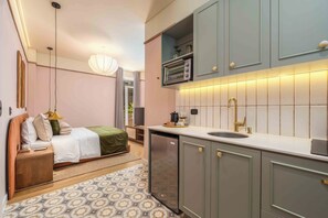 Microwave, stovetop, coffee/tea maker, cookware/dishes/utensils