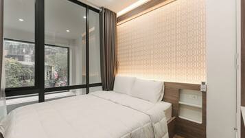 Desk, laptop workspace, free WiFi, bed sheets