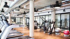A gym with treadmills, elliptical machines, and exercise balls. - Chapter Lewisham Student Only Cozy Stay (London)