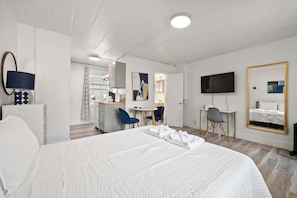 Studio, 1 Queen Bed, Patio, Garden View (Chic City Retreat 93F) | Individually decorated, individually furnished, desk, laptop workspace