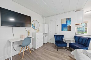 Studio, 1 Queen Bed, Patio, Garden View (Chic City Retreat 93G) | Living area | 42-inch flat-screen TV with digital channels