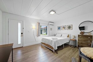 Studio, 1 Queen Bed, Patio, Garden View (Chic City Retreat 93H) | Individually decorated, individually furnished, desk, laptop workspace