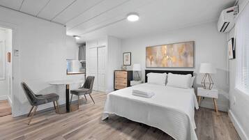 Studio, 1 Queen Bed, Patio, Garden View (Chic City Retreat 93E) | Individually decorated, individually furnished, desk, laptop workspace